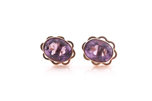 Lot 110 - A pair of amethyst stud earrings, the oval...