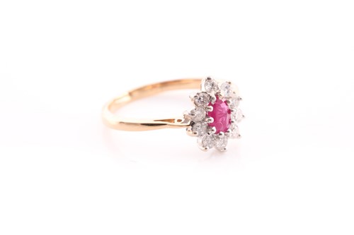 Lot 35 - A ruby and diamond cluster ring set in yellow...