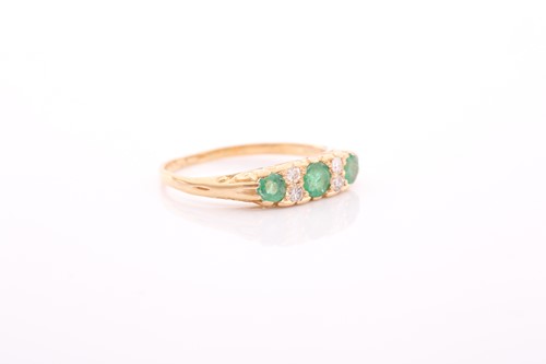 Lot 9 - An early 20th century gold, emerald and...