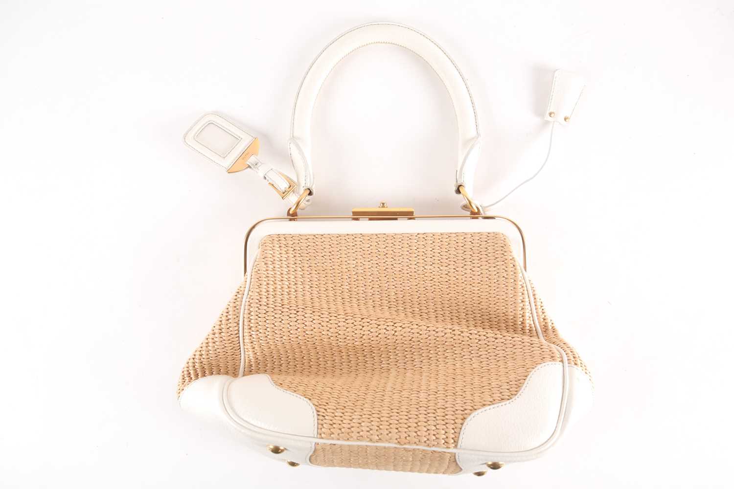 Lot 265 - A Prada weave and white leather handbag, the...