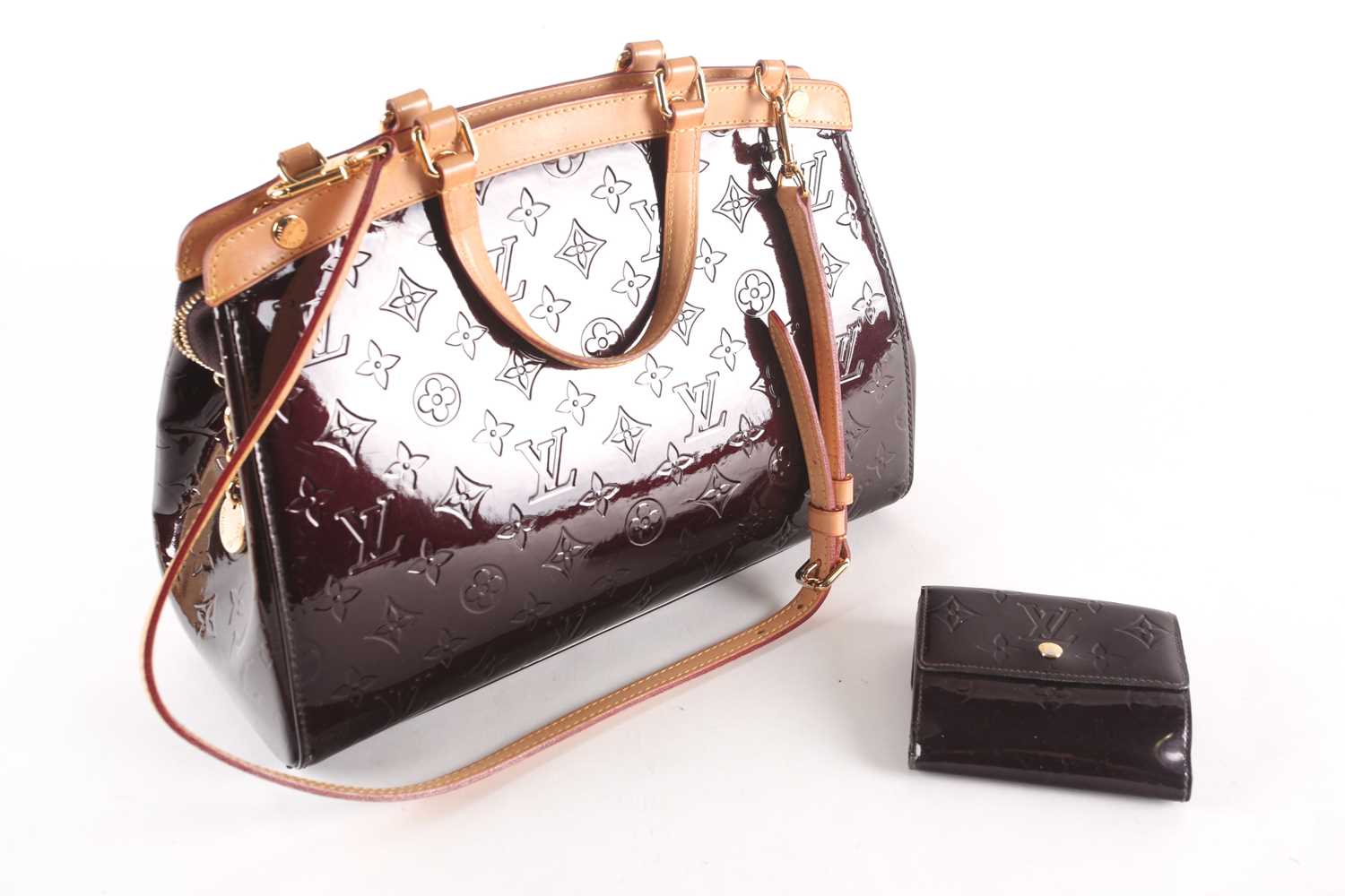 Lot 260 - A Louis Vuitton dark maroon patent leather