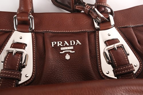 Lot 262 - A Prada brown leather handbag with chrome...