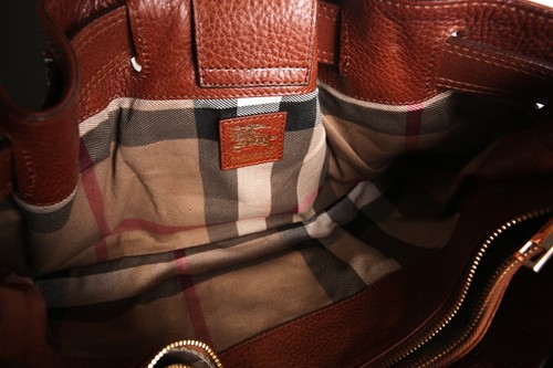 Lot 267 - A Burberry brown leather shoulder bag with...