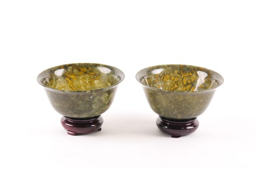 Lot 250 - A pair of spinach green bowls, possibly...