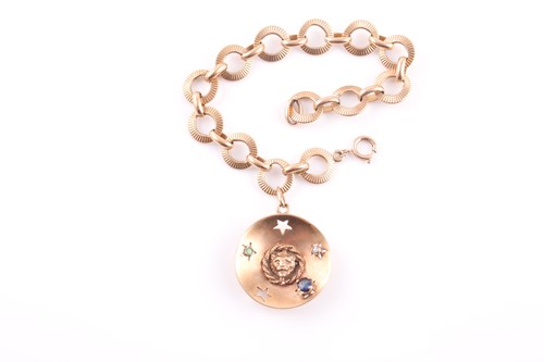 Lot 96 - A gold textured-circlet link bracelet on a...