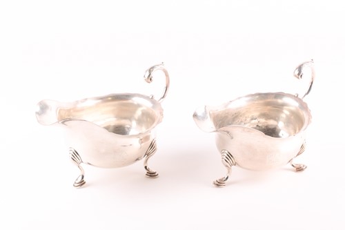 Lot 281 - A pair of Edwardian silver gravy boats of...