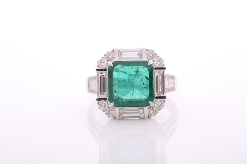 Lot 34 - An emerald and diamond square cluster ring,...