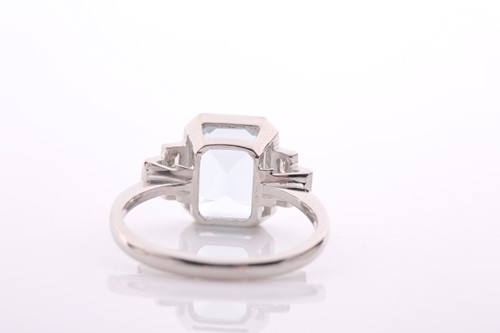 Lot 73 - An aquamarine and diamond dress ring in Art...