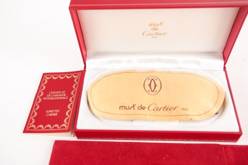 Lot 261 - A pair of Must de Cartier 1980s vintage gold...