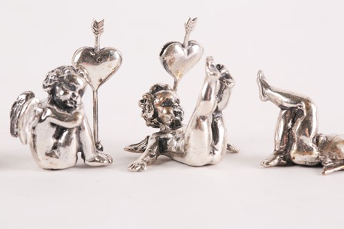 Lot 313 - A set of six modern cast silver cherub name...