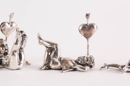 Lot 313 - A set of six modern cast silver cherub name...