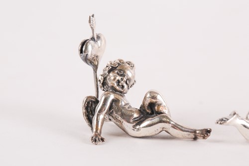 Lot 313 - A set of six modern cast silver cherub name...