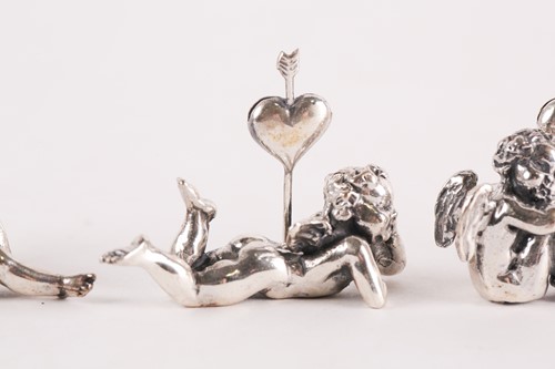 Lot 313 - A set of six modern cast silver cherub name...