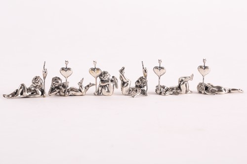 Lot 313 - A set of six modern cast silver cherub name...