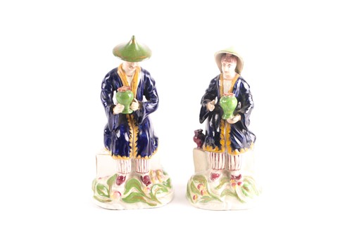 Lot 445 - A rare pair of Staffordshire hollow molded...