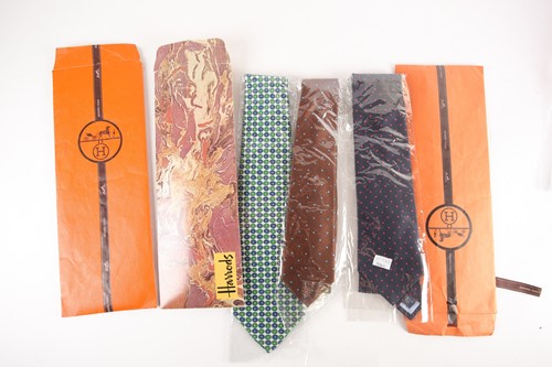 Lot 389 - Five Hermes silk ties, two with original...