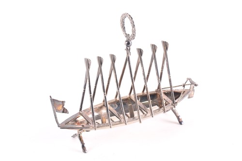 Lot 310 - A silver plated six division toast rack in the...