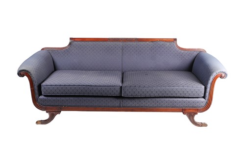 Lot 89 - A Regency style mahogany scroll end sofa. With...