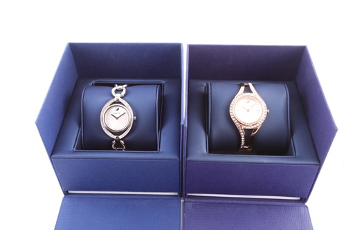 Lot 410 - Two Swarovski lady's watches, both with round...