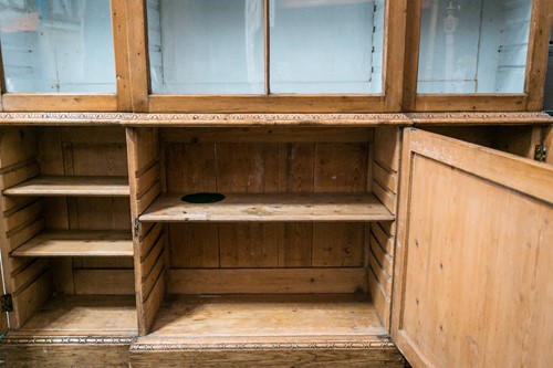 Lot 109 - A George III pine breakfront cupboard bookcase...