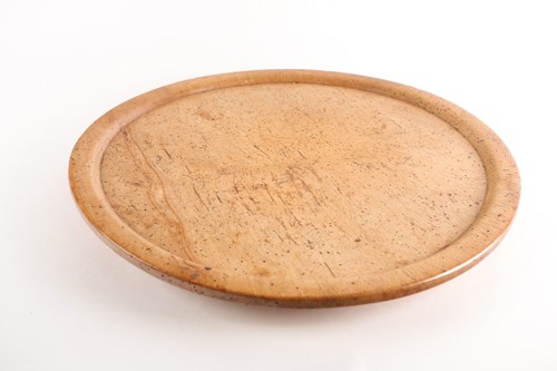 Lot 231 - A large sycamore charger, with recessed field...