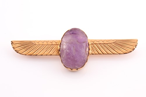 Lot 106 - A yellow metal and amethyst scarab brooch, set...
