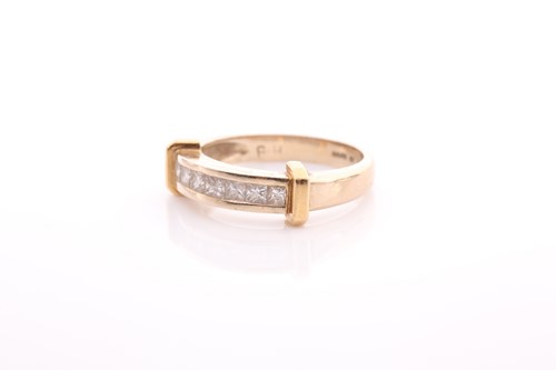 Lot 82 - A seven stone half hoop diamond ring; the...