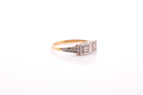 Lot 200 - An Art Deco two stone diamond ring; the two...
