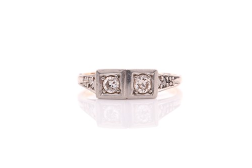 Lot 200 - An Art Deco two stone diamond ring; the two...