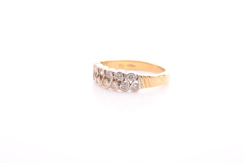 Lot 62 - A two row 18 carat gold and diamond half hoop...