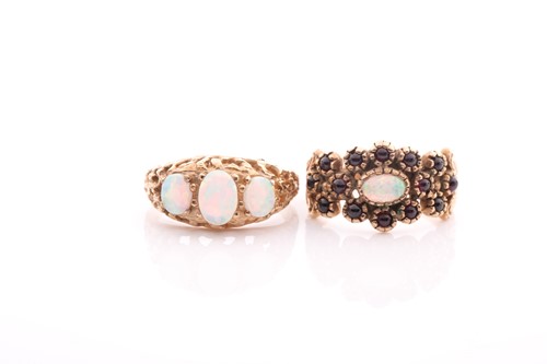 Lot 107 - A three stone half hoop opal ring, in carved 9...
