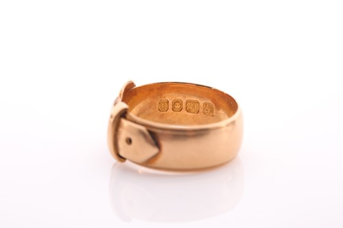 Lot 232 - A late Victorian 18 carat gold buckle ring...