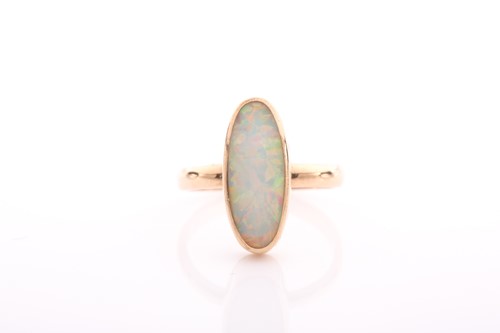 Lot 154 - A single stone opal ring, the elongated oval...