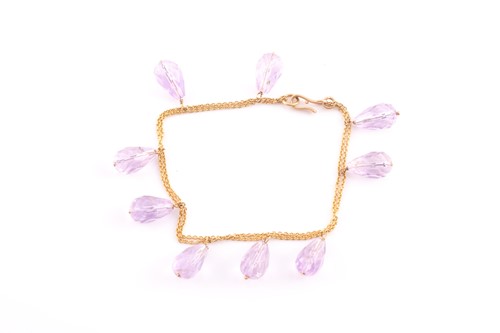 Lot 169 - A yellow metal and amethyst bracelet, the...