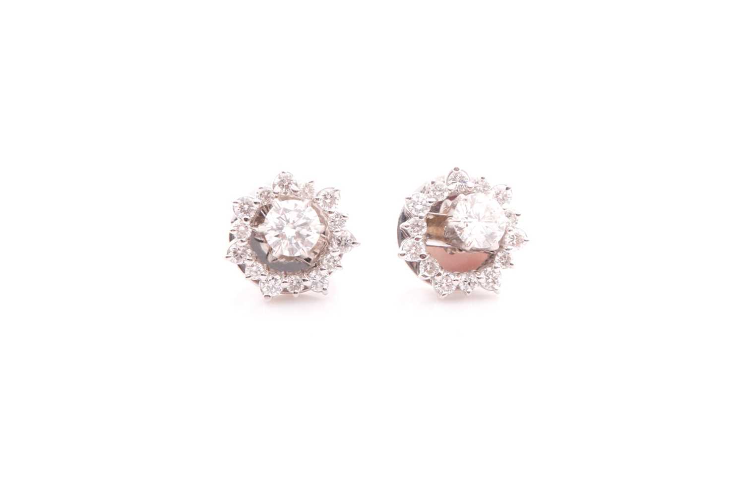 Lot 70 - A pair of diamond cluster earrings, set with a...