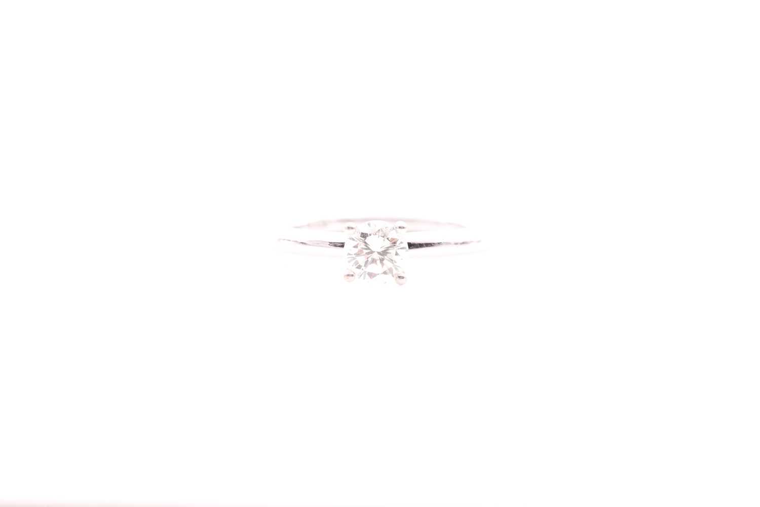 Lot 190 - An 18ct white gold and solitaire diamond ring,...