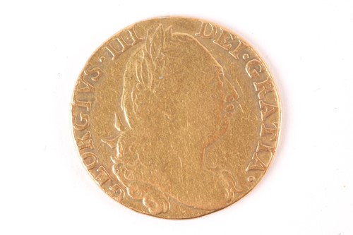 Lot 374 - A George III guinea, 1775, fourth laureate...
