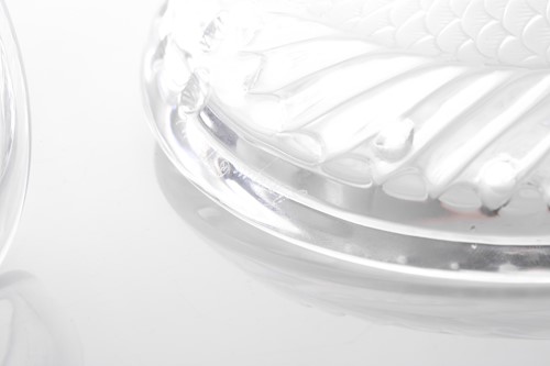 Lot 423 - A Lalique frosted glass fish ashtray with...