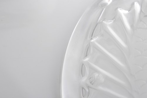 Lot 423 - A Lalique frosted glass fish ashtray with...