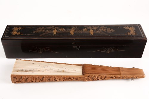 Lot 297 - A Chinese carved sandalwood and silk...