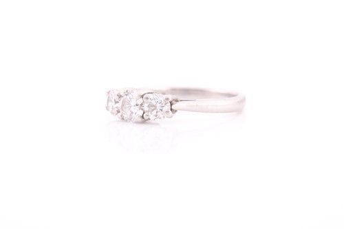Lot 327 - A platinum and diamond ring, set with three...