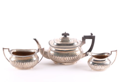 Lot 408 - An early 20th century matched three-piece tea...