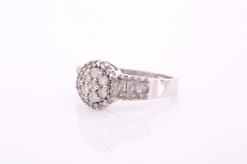 Lot 54 - A 9ct white gold and diamond cluster ring, set...