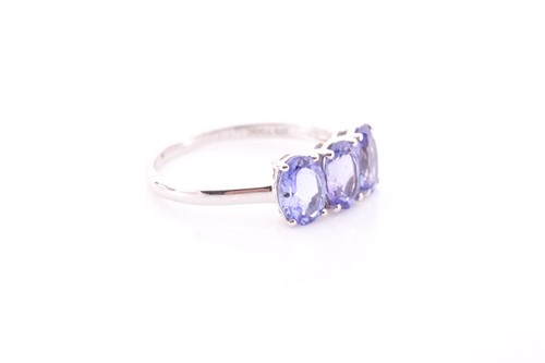 Lot 306 - A 9ct yellow gold and tanzanite ring, set with...