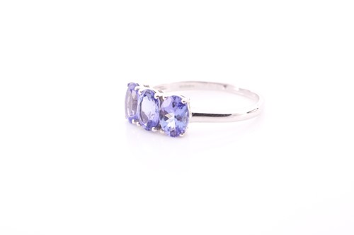 Lot 306 - A 9ct yellow gold and tanzanite ring, set with...