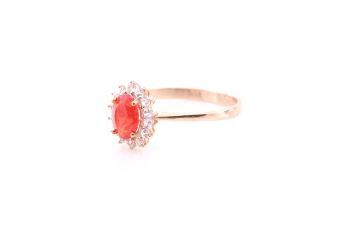 Lot 289 - A 9ct yellow gold, fire opal, and white topaz...