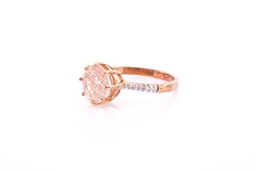 Lot 152 - A 9ct yellow gold and rutilated quartz ring,...