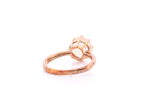 Lot 152 - A 9ct yellow gold and rutilated quartz ring,...