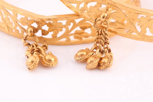 Lot 266 - A pair of Indian yellow metal bracelet bangles,...