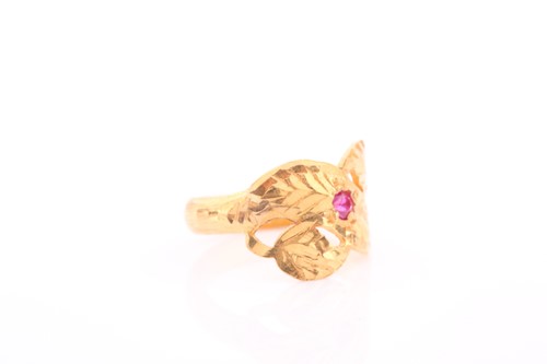 Lot 132 - An Indian yellow metal and red stone ring, the...